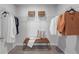 Walk-in closet with ample shelving, hanging space, and a seating bench at 512 Crown Dr, Emerson, GA 30137