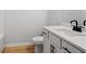 Modern bathroom featuring a sink with black hardware and wood-look flooring at 514 Crown Dr, Emerson, GA 30137