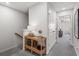 Hallway featuring gray carpeted floor with a wicker shelf, and white doors at 514 Crown Dr, Emerson, GA 30137