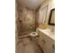 Tiled bathroom featuring a glass-enclosed shower, modern vanity, and neutral finishes at 8130 Estee Dr, Cumming, GA 30028