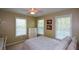 Comfortable bedroom with natural light, neutral walls, and soft carpet, providing a relaxing space at 8130 Estee Dr, Cumming, GA 30028