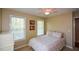 Cozy bedroom with natural light, plush carpet, and a serene view at 8130 Estee Dr, Cumming, GA 30028