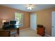 Bedroom with carpet, ceiling fan, and window bringing in lots of natural light at 8130 Estee Dr, Cumming, GA 30028