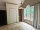 Bright dining area with large window views and a view to the deck at 8130 Estee Dr, Cumming, GA 30028