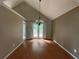 Bright dining room with wood floors and french doors to outdoor deck at 8130 Estee Dr, Cumming, GA 30028