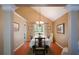 Bright dining room featuring wood floors and a classic chandelier at 8130 Estee Dr, Cumming, GA 30028