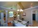Well-lit dining room with wood floors and a view of the living room at 8130 Estee Dr, Cumming, GA 30028