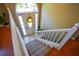 Foyer with hardwood floors, staircase, and front door with decorative wreath at 8130 Estee Dr, Cumming, GA 30028