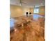 Spacious living room with stained concrete flooring, recessed lighting, and modern ceiling fans at 8130 Estee Dr, Cumming, GA 30028
