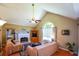 Inviting living room with vaulted ceiling, fireplace, and natural light at 8130 Estee Dr, Cumming, GA 30028