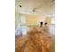 Spacious living room with stained concrete flooring, recessed lighting, and modern ceiling fans at 8130 Estee Dr, Cumming, GA 30028