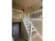 Carpeted staircase with white railing leading to the upper level at 8130 Estee Dr, Cumming, GA 30028