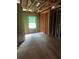 Unfinished bedroom features one window with view of wooded backyard, and exposed framing ready for drywall at 1163 Park Center Cir, Austell, GA 30168
