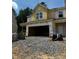 New construction featuring a large garage and siding, ready for finishing touches and personalization at 1163 Park Center Cir, Austell, GA 30168