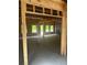 Unfinished interior space featuring exposed framing and large windows, offering customizable design options at 1163 Park Center Cir, Austell, GA 30168