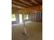 Open living space featuring unfinished walls and ceilings with natural light streaming through the framed windows at 1163 Park Center Cir, Austell, GA 30168