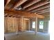 Open floor plan with exposed framing, ready for customization with windows and doors in place at 1163 Park Center Cir, Austell, GA 30168