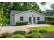 A beautiful backyard with a privacy fence, a small patch of grass and a building with white siding at 1272 Hardee Ne St, Atlanta, GA 30307