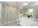 Modern bathroom featuring a glass-enclosed shower, double vanity, and marble accents at 1272 Hardee Ne St, Atlanta, GA 30307