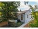 Charming white brick home featuring a covered porch, landscaped yard, and modern architectural details at 1272 Hardee Ne St, Atlanta, GA 30307