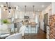 Stylish kitchen with stainless steel appliances, white cabinets, granite countertops, and eat-in bar at 1272 Hardee Ne St, Atlanta, GA 30307