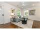 Bright living room features a modern ceiling fan, neutral color palette, and sleek, contemporary furnishings at 1272 Hardee Ne St, Atlanta, GA 30307