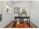 Sunlit office space with a desk, chair, and natural wood accents, creating a productive and stylish workspace at 1272 Hardee Ne St, Atlanta, GA 30307