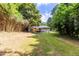 Large backyard featuring mature trees, a bamboo privacy screen, wooden deck and rear of home at 3205 Mcafee Rd, Decatur, GA 30032