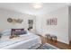 Bright bedroom featuring hardwood floors, white walls, and stylish decor at 3205 Mcafee Rd, Decatur, GA 30032