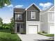 Two-story townhome featuring mixed siding, a garage, and a well-manicured lawn at 510 Crown Dr, Emerson, GA 30137