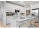 Modern kitchen with white cabinets, stainless steel appliances, and quartz countertops at 510 Crown Dr, Emerson, GA 30137