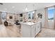 Open-concept floor plan showcases a kitchen island overlooking a spacious living and dining area at 510 Crown Dr, Emerson, GA 30137