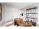 Bright office with wooden desk, shelf, white walls, and an armchair near a large window at 510 Crown Dr, Emerson, GA 30137