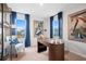 Bright office with large windows, blue curtains, modern desk, and comfortable armchair at 510 Crown Dr, Emerson, GA 30137