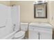 Neat bathroom featuring a bathtub, toilet, and vanity with storage at 115 Camelot Dr, Atlanta, GA 30349
