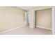 Bedroom features tile floors and closet with exposed racks at 115 Camelot Dr, Atlanta, GA 30349