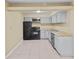 Functional kitchen equipped with standard appliances and ample cabinet space at 115 Camelot Dr, Atlanta, GA 30349