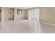 Open living room with a sliding glass door offering natural light and outdoor views at 115 Camelot Dr, Atlanta, GA 30349