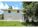 Charming home featuring a backyard with white painted brick, an outdoor structure, and a verdant lawn at 1894 Twin Falls Rd, Decatur, GA 30032