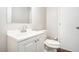 Clean bathroom features a white vanity, mirror, and toilet, creating a functional space at 1894 Twin Falls Rd, Decatur, GA 30032