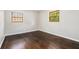 Empty bedroom featuring wood floors, two windows, and neutral paint at 1894 Twin Falls Rd, Decatur, GA 30032