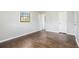 Bright bedroom with wood floors and neutral walls features closet space at 1894 Twin Falls Rd, Decatur, GA 30032