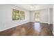 Spacious bedroom with gleaming hardwood floors and bright, natural light through windows at 1894 Twin Falls Rd, Decatur, GA 30032