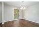 Bright dining room with hardwood floors and a chandelier at 1894 Twin Falls Rd, Decatur, GA 30032