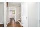 Inviting hallway with hardwood floors and white trim, offering a view into the adjacent room at 1894 Twin Falls Rd, Decatur, GA 30032