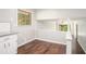 Eat-in kitchen with wood floors, white cabinets, and granite countertops at 1894 Twin Falls Rd, Decatur, GA 30032
