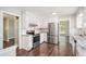 Spacious kitchen boasts stainless steel appliances, white cabinets, and granite countertops at 1894 Twin Falls Rd, Decatur, GA 30032