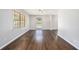 Large living room with new wood floors, fan, and lots of light at 1894 Twin Falls Rd, Decatur, GA 30032