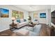 Bright living room with hardwood floors, neutral furniture, and natural light from windows at 1894 Twin Falls Rd, Decatur, GA 30032