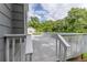 Elevated deck with white railing overlooking the yard and offering an outdoor space for relaxation at 4856 Habersham Sw Rdg, Lilburn, GA 30047